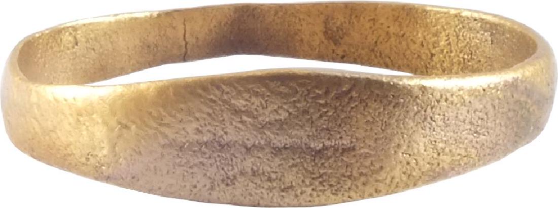 VIKING WEDDING RING 10th-11th CENTURY: Gilt bronze. Size 7 1/2. Slightly rounded band with very slightly expanded medial. Professionally refurbished with the gold overlay restored. Vikings exchanged wedding rings on the pommel of the groom