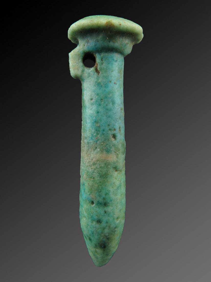 Egyptian Faience Papyrus Sceptre: Egyptian faience Papyrus sceptre 664 - 332 BC. The Papyrus sceptre meaning: Flourishing, as of green plants; youth. It refers to chapter 159 of the Book of the Dead. Faience High: 45 mm. Diameter: 13