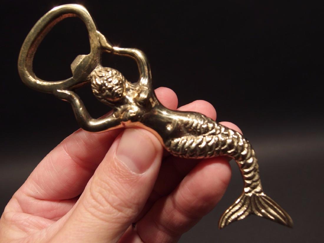 Brass Mermaid Lady Soda Beer Bottle Cap Opener: Antique Vintage Style Brass Nude Lady Soda Beer Bottle Cap Opener Description 4 7/8" Long ..1 1/4" Wide Great reproduction heavy solid brass bottle opener. This piece was made to look just like an ant