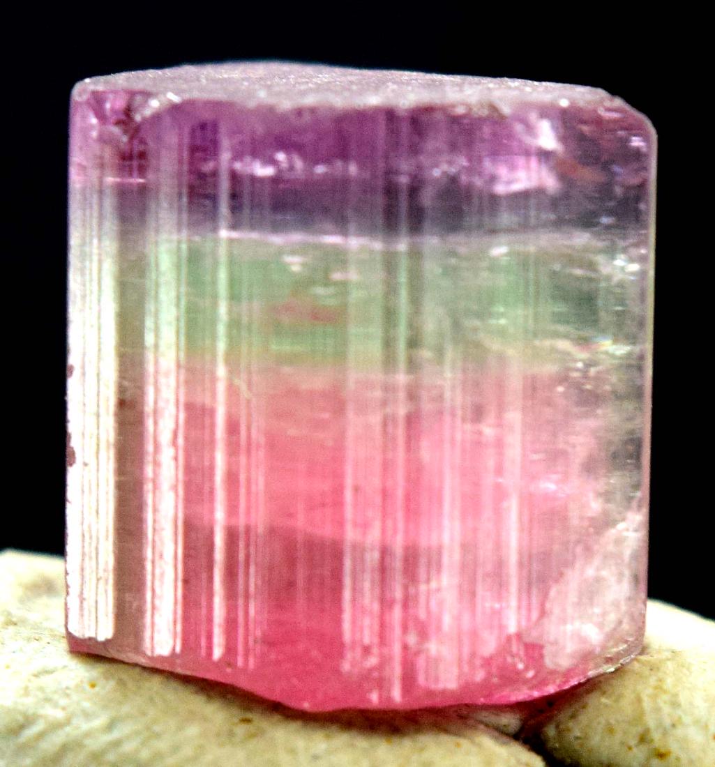 Terminated Purplish Pink Cap Tourmaline Crystal: Terminated Purplish Pink Cap Tourmaline Crystal Weight : 25.20 carats Size : 15*14*11 mm Treatment : Natural Origin : Paproke Afghanistan Standard DHL Shipping Please note that this lot has a confiden
