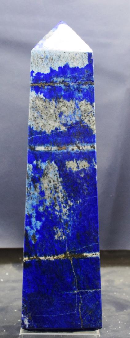 1069 Gram self standing lapis lazuli obelisk: 1069 Gram self standing lapis lazuli obelisk weight : 1069 Gram Dimensions : 199*54*50 mm origin : Afghanistan Standard DHL Shipping Please note that this lot has a confidential reserve. When you leav