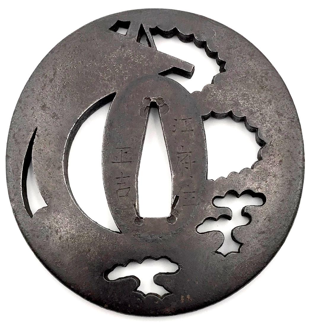 Signed iron sukashi tsuba by Masayoshi: Item: Signed iron sukashi tsuba by Masayoshi Origin: Japan Date: Edo period, late 18th century Materials: Iron Dimensions: 74.6 x 71.6 x 5.0 mm Iron tsuba of elongated round form with the design of a 