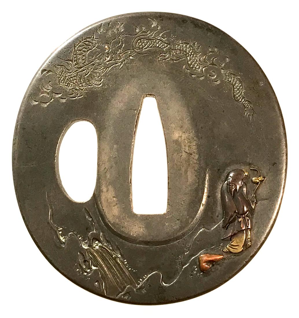 Tsuba of shibuichi carved and inlaid with brass and: Item: Tsuba of shibuichi carved and inlaid with brass and copper Origin: Japan Date: Edo period Materials: Shibuichi, brass, copper Dimensions: 65.8 x 61.7 x 4.8 mm Shibuichi tsuba finely carved in ka