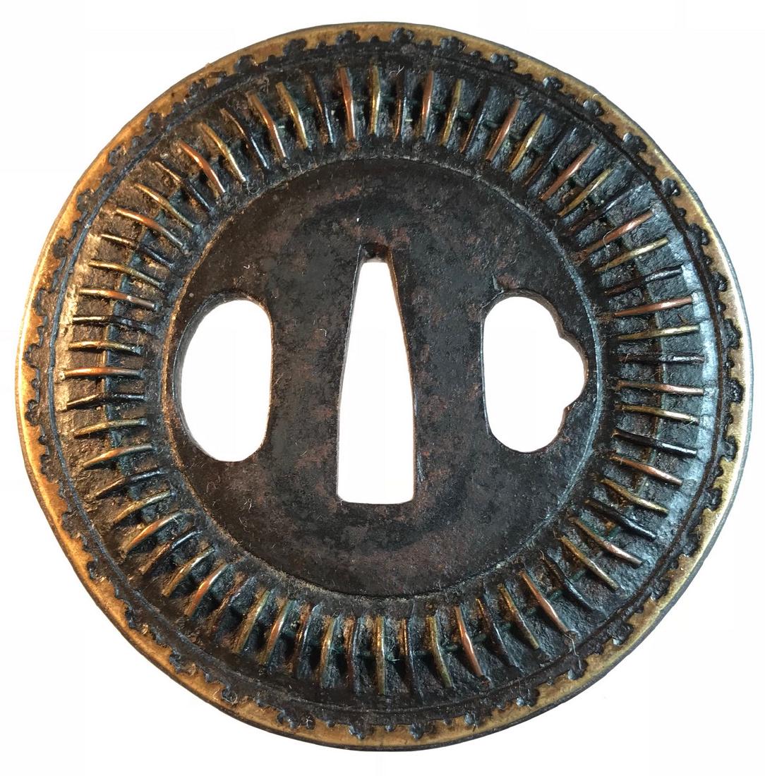 Shingen tsuba of mukade design with iron, copper, and (1 of 2)
