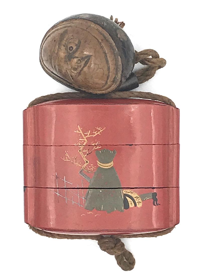 Three-section lacquer inro with netsuke: Item: Three-section lacquer inro with netsuke Origin: Japan Date: Edo or Meiji Materials: Lacquer, chestnut Dimensions: 6.7 x 7.5 x 2.4 cm Inro with rural landscape on one side and Shoki - Demon Quell