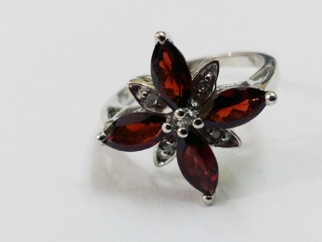 Garnet and Diamond Ring: Title: Garnet and Diamond Ring Metal Purity (If Applicable): 925 Gemstones: Hessonite Garnet and Diamond Gross weight of Artical: 3.43 Carat Weights: Size/Dimensions: 7.5 Additional Info: Please note 