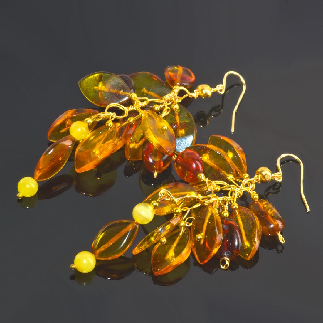 Cluster' Earrings with Natural Baltic Amber: Item: Cluster' Earrings with Natural Baltic Amber Brand: Regenz Metal Purity: .925 sterling silver Gemstones: Natural Baltic Amber of Honey, Congac and Egg Yolk colors Size/Dimensions: External length