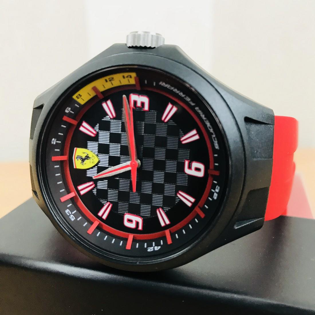 Scuderia Ferrari – Men’s Wrist Watch – New With Box: Ferrari Men's watch. Features a 43mm wide and 13mm thick plastic case with a fixed bezel and textured push-pull crown. This watch is powered by an accurate quartz movement. Scratch resistant mineral c