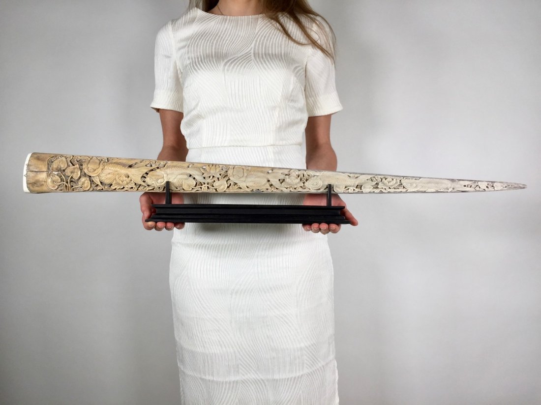 Stunning swordfish tusk with hand engraved Japanese koi: Title: Stunning swordfish tusk with hand engraved Japanese koi fish scene Maker: Design: Jake Richmond Origin: Indonesia Date/Period: 2017 Materials: Bone, Wood Dimensions: Width 90cm / 35.4 inches Th