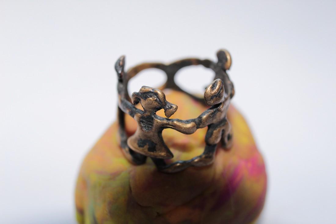 Post Medieval Child Bronze Ring With Boys and Girls: Post medieval child bronze ring with boys and girls Origin: Europe Period: 20th - 21st century AD Material: bronze Size: D16mm place of discovery - Ukraine, Ukrainian private collection Please note th