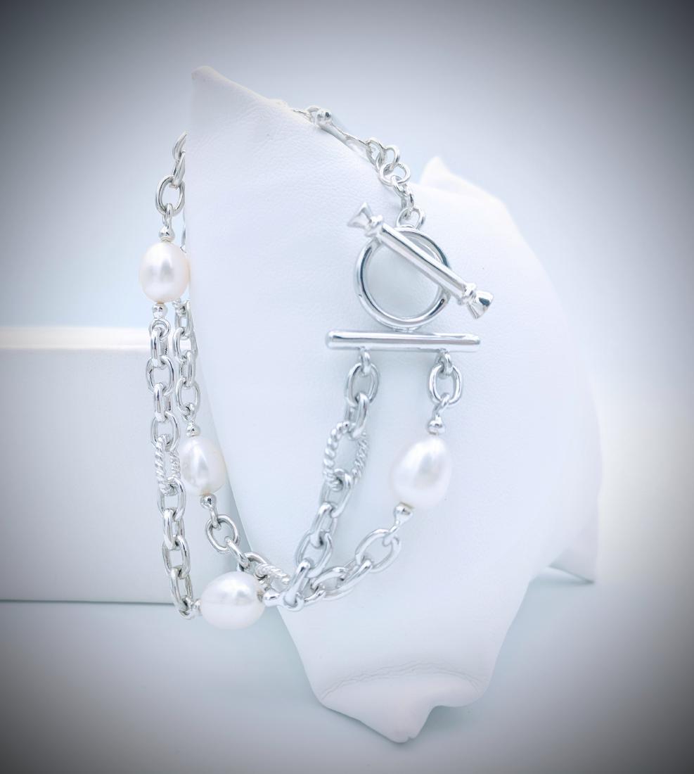 Sterling Silver Bracelet with Double Chains and Pearls: Item: Sterling Silver Bracelet with Double Chains and Pearl's Brand: Jean Lin Collection Metal Purity: 925 Sterling Silver Gemstones: Pearls Carat Weights: 5 Pearl's at 8mm each. Size/Dimensions: Brac