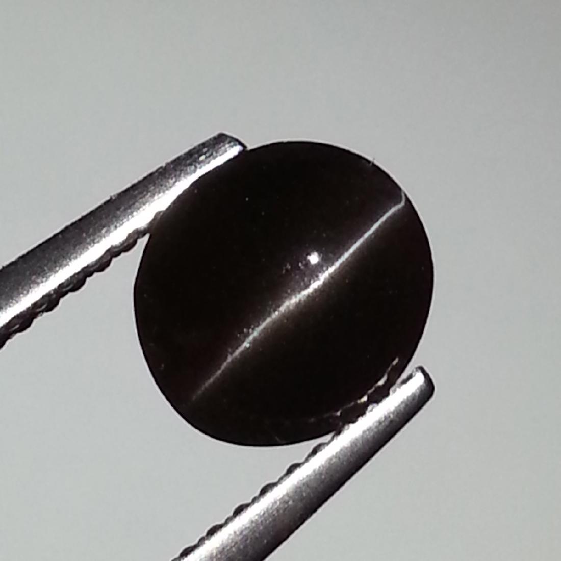 Sillimanite Cat's Eye - 2.43 ct: Item: Sillimanite Cat's Eye - 2.43 ct Loose gemstone Color/Clarity: Opaque Carat Weight: 2.43 Size (mm): 8.40 x 7.60 x 5.30 Oval - Africa No Reserve: This lot starts at $1 and has no reserve as a cour
