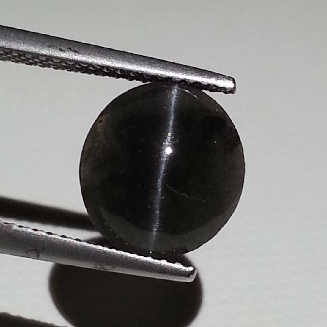 Sillimanite Cat's Eye - 3.37 ct: Item: Sillimanite Cat's Eye - 3.37 ct Loose gemstone Color/Clarity: Opaque Carat Weight: 3.37 Size (mm): 10.65 x 9.70 x 4.45 Oval - Africa No Reserve: This lot starts at $1 and has no reserve as a cou