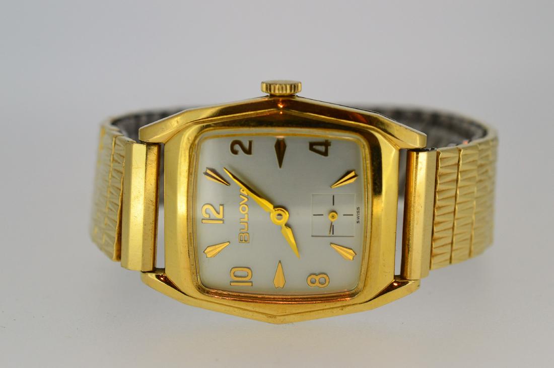 Men's Bulova 14k Gold Filled Watch: Item: Men's Bulova 14k Gold Filled Watch Brand: Bulova Date: 1950's Case Metal: 14k gold filled stainless steel Case Size: 27mm Bracelet Length: 7" flex band With original bracelet Please note that th