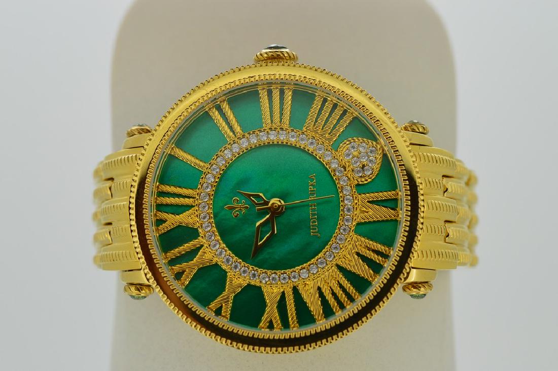 Judith Ripka Ladies Wristwatch with Green and Gold: Item: Judith Ripka Ladies Wristwatch with Green and Gold Brand: Judith Ripka Date: Modern Movement: Quartz Case Metal: Stainless steel back Case Size: 37mm Bracelet Type: Stainless steel Bracelet Leng