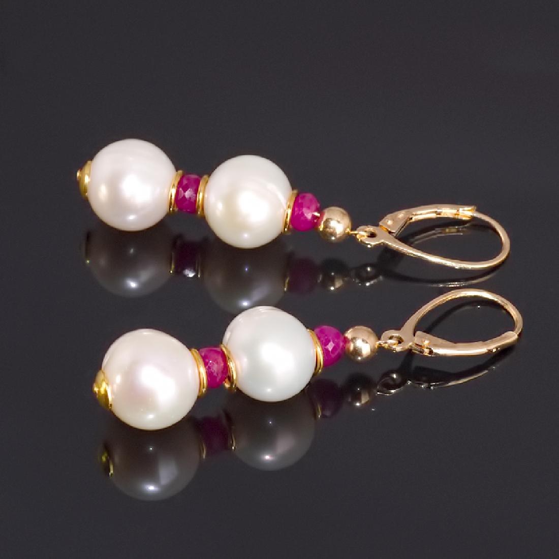 Classic Style Pearls and Rubies Earrings: Title: Classic Style Pearls and Rubies Earrings Metal Purity: .925 sterling silver Gemstones: Pearl, Ruby Size: External length (inc. fittings) ~ 1.9" (4.8 cm) Pearl off-round ~ 10-11 mm Ø, cultured 
