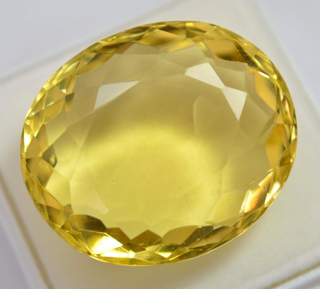 80.80 Ct Shiny Lemon Citrine GGL Certified: PRODUCT NAME : Citrine SHAPE: Oval COLOR: Yellow QUANTITY: 1 Piece WEIGHT: 80.80 Ct SIZE: 31.77 x 23.03 x 13.80 mm Origin: Brazil TREATMENT: Hue Enhanced SPECIES : Quartz No Reserve: This lot starts