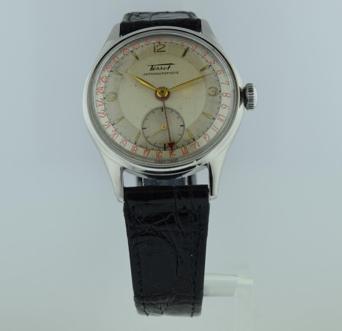 Tissot Stainless Steel Calendar Watch, 1970: Watch: Tissot Stainless Steel Calendar Watch Date: 1970s Movement: Mechanical, hand winding Function: Calendar around perimeter of watch in red numbers Case Type: Stainless steel Case Size: 35mm Brace