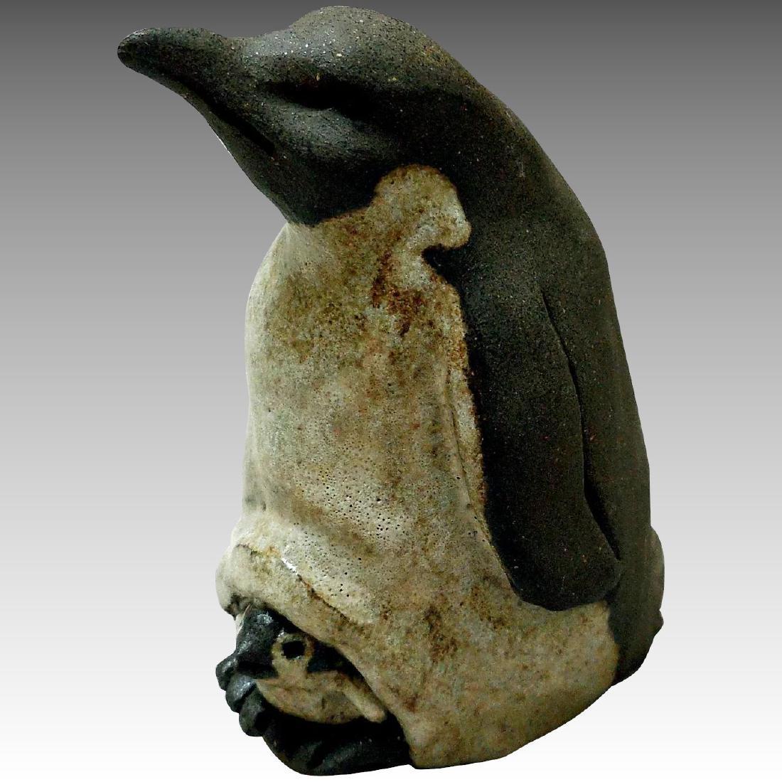 Studio Pottery, Emperor Penguin & Baby: Title: Studio Pottery, Emperor Penguin & Baby Maker: B. Day Origin: Unknown Date/Period: Late 20th Century Materials: Pottery, Glass Size: 4 Inches high, 3 Inches wide This endearing sculpture has gla