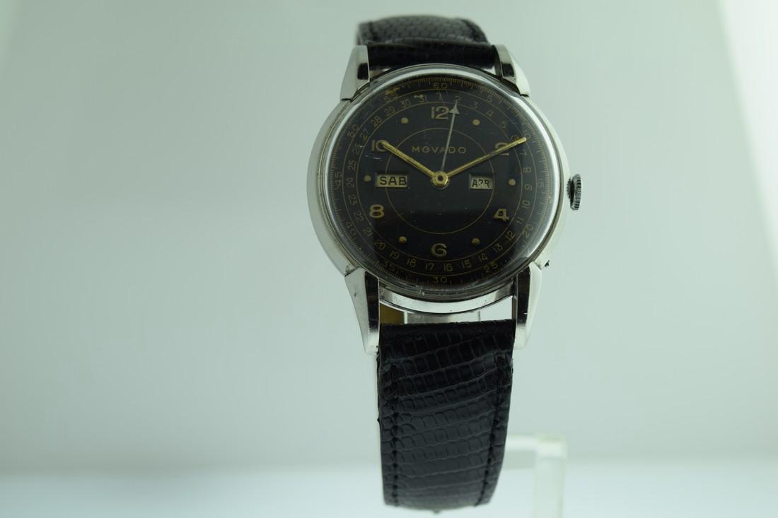 Vintage Movado Triple Calendar Watch, 1950s: Brand: Movado Watch: Vintage Movado Triple Calendar Watch, 1950s Date: 1950s Movement: Manual wind Case Metal: Stainless steel Case Size: 35 mm Bracelet Type: Leather Bracelet Length: 7.5 inches Day,