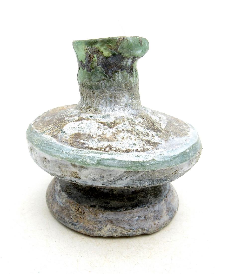 Ancient Roman Glass Flask -re: Title: Ancient Roman Glass Flask -re Date: C. 100 - 300 A.D. Attractive Ancient Roman Glass Flask with beautiful irridescence in original, ancient unrestored condition. Charming small item suitable fo