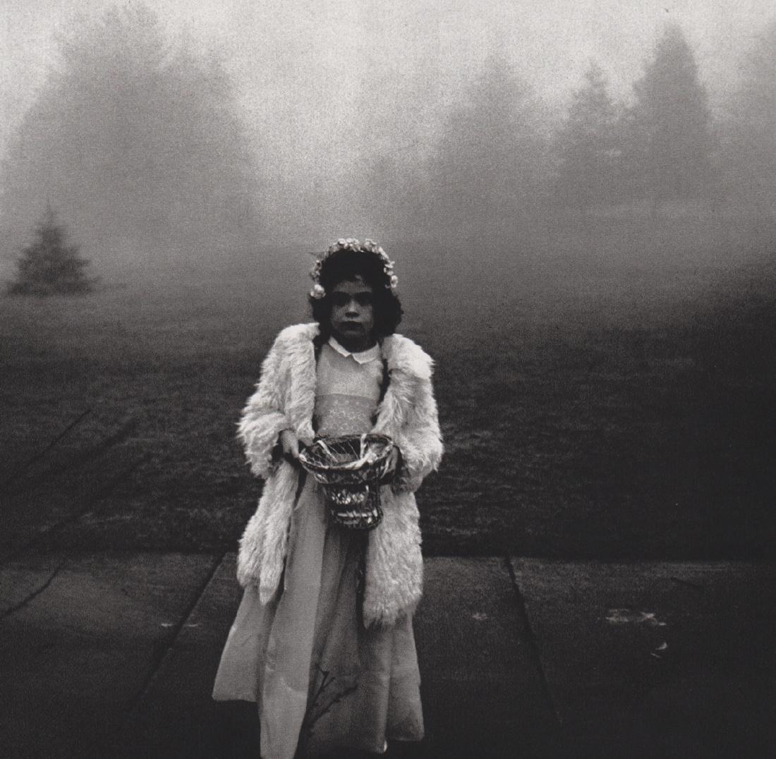 DIANE ARBUS - Young Girl in Dress-up: Artist: DIANE ARBUS Print Title: Young Girl in Dress-up Medium: Sheet-fed Gravure Printing Date: 1972 Printed in Switzerland Image Size: 7 x 7 inches Diane Arbus was an American photographer often reg