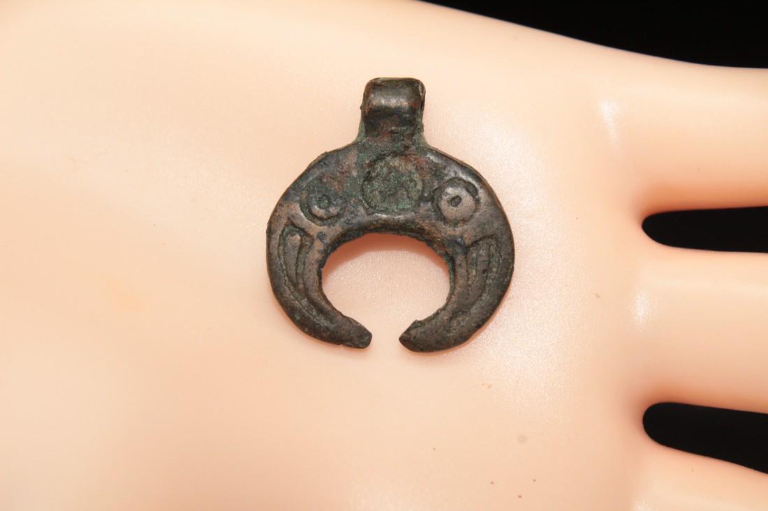 Medieval Bronze Luna (moon) Pendant of Kievan Rus: Title: Medieval bronze luna (moon) pendant of Kievan Rus Origin: Europe Period: 9 th - 14 th century Material: bronze Size: 21x24 mm Place of Discovery: Ukraine Please note that this lot has a confide