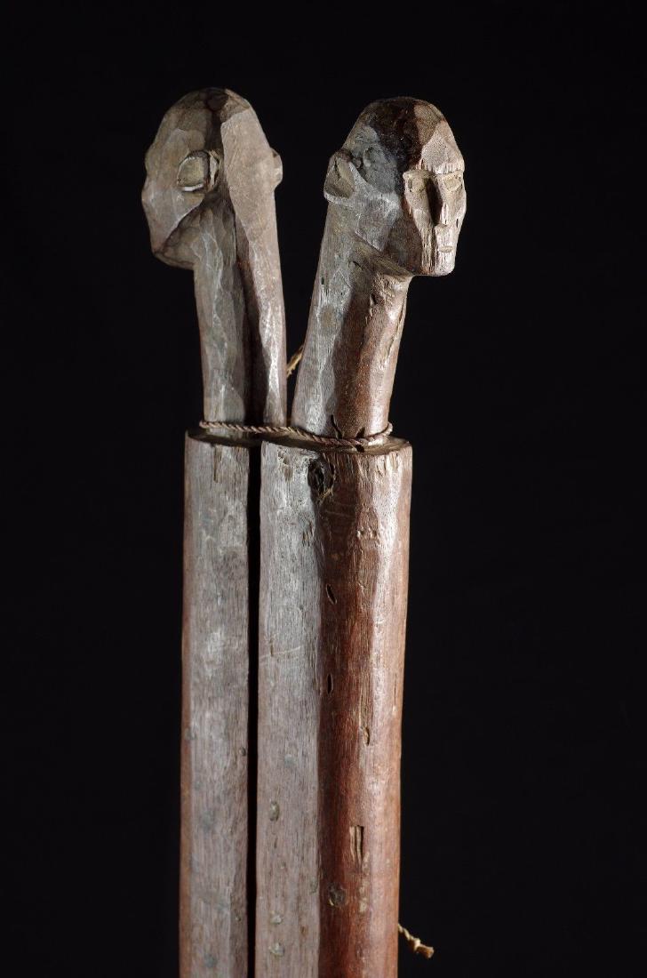 Carved Antropomorphic Weaving Sticks West Timor: On the remote island of Timor women still spinn their cotton, prepare their own dyes of indigo and morinda, and weave on traditional beck tension looms. These two sticks are part of the loom, they are
