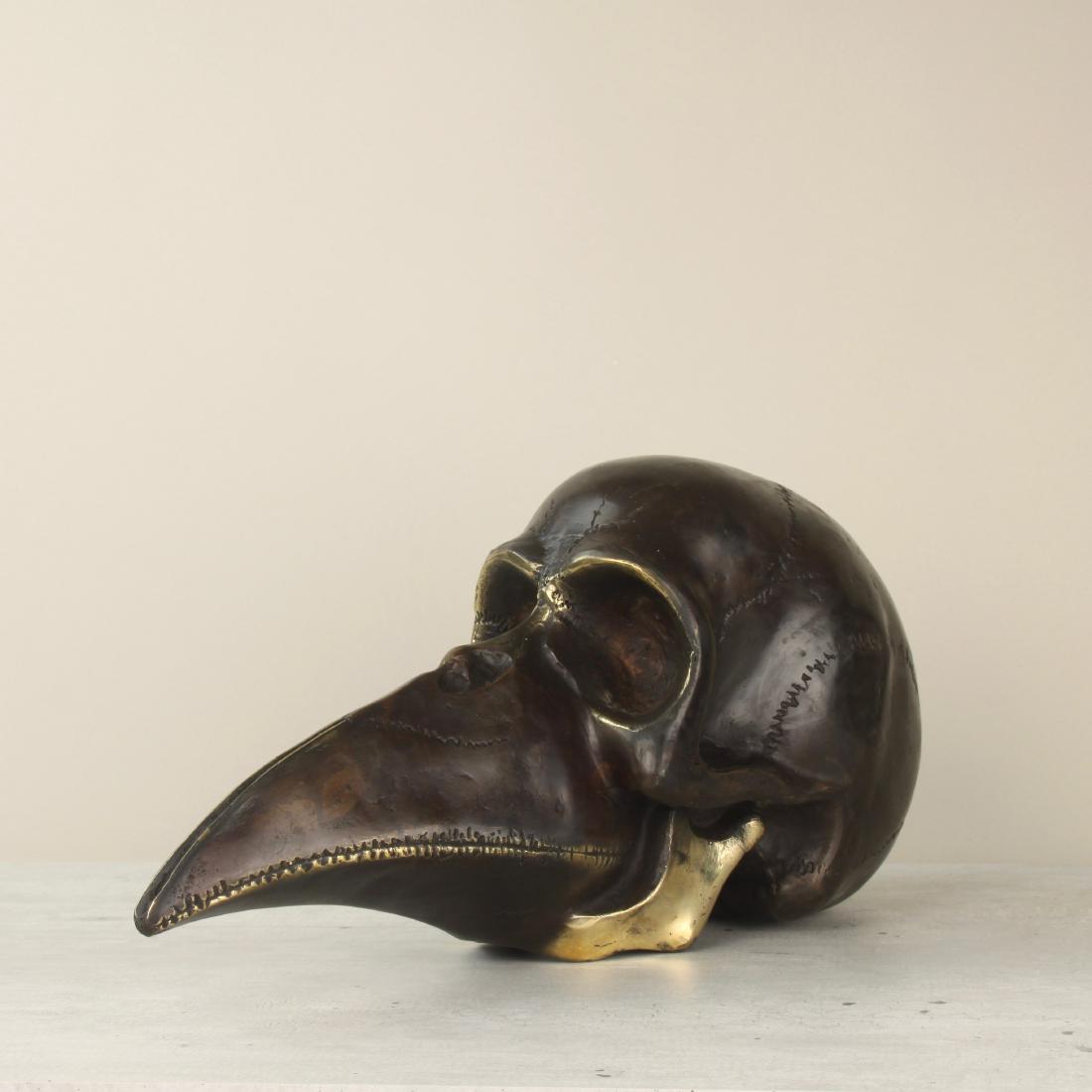 Mythical bronze beaked figure, half man half bird, (1 of 8)