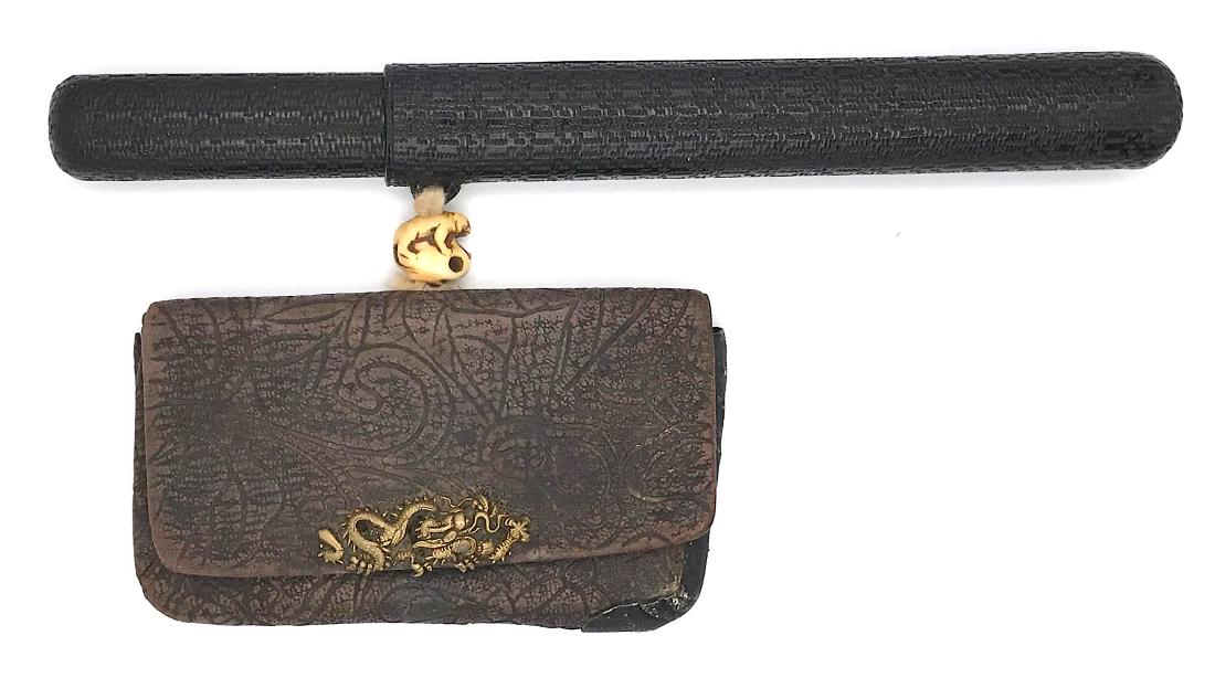 Tobacco-pouch (doran), pipecase (kiseru-zutsu) with a: Item: Tobacco-pouch (doran), pipecase (kiseru-zutsu) with a pipe, and ojime; kanamono with dragon motif Origin: Japan Date: Edo/Meiji Materials: Lacquer, wood, silver, brass, leather, bone Dimensions: