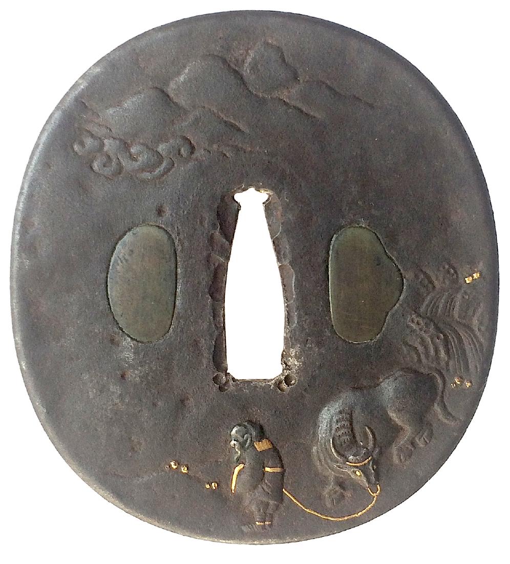 Iron tsuba carved and inlaid with gold: Item: Iron tsuba carved and inlaid with gold Origin: Japan Date: Edo period Materials: Iron, gold Dimensions: Height: 77.2 mm; Width: 70.5 mm; Thickness: 3.0 mm; Weight: 111 g Iron tsuba of oval form 