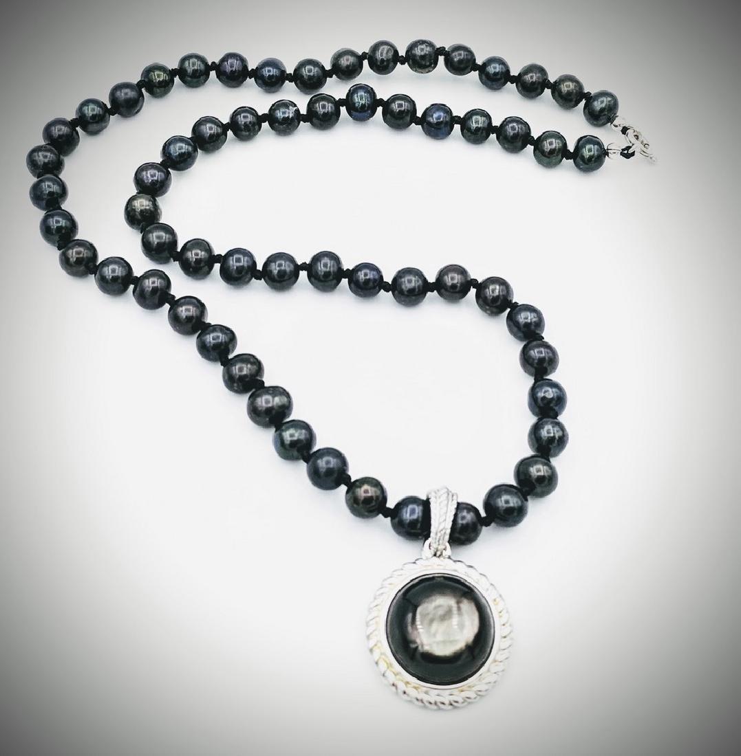 Sterling Silver Moonstone and Black Beads Necklace: Item: Sterling Silver Moonstone and Black Beads NecklaceBrand: Jean Lin Collection Metal Purity: 925 Sterling SilverGemstones: MoonstoneSize: Necklace measures at 44cm in length 60 Black Beads at 6.8m