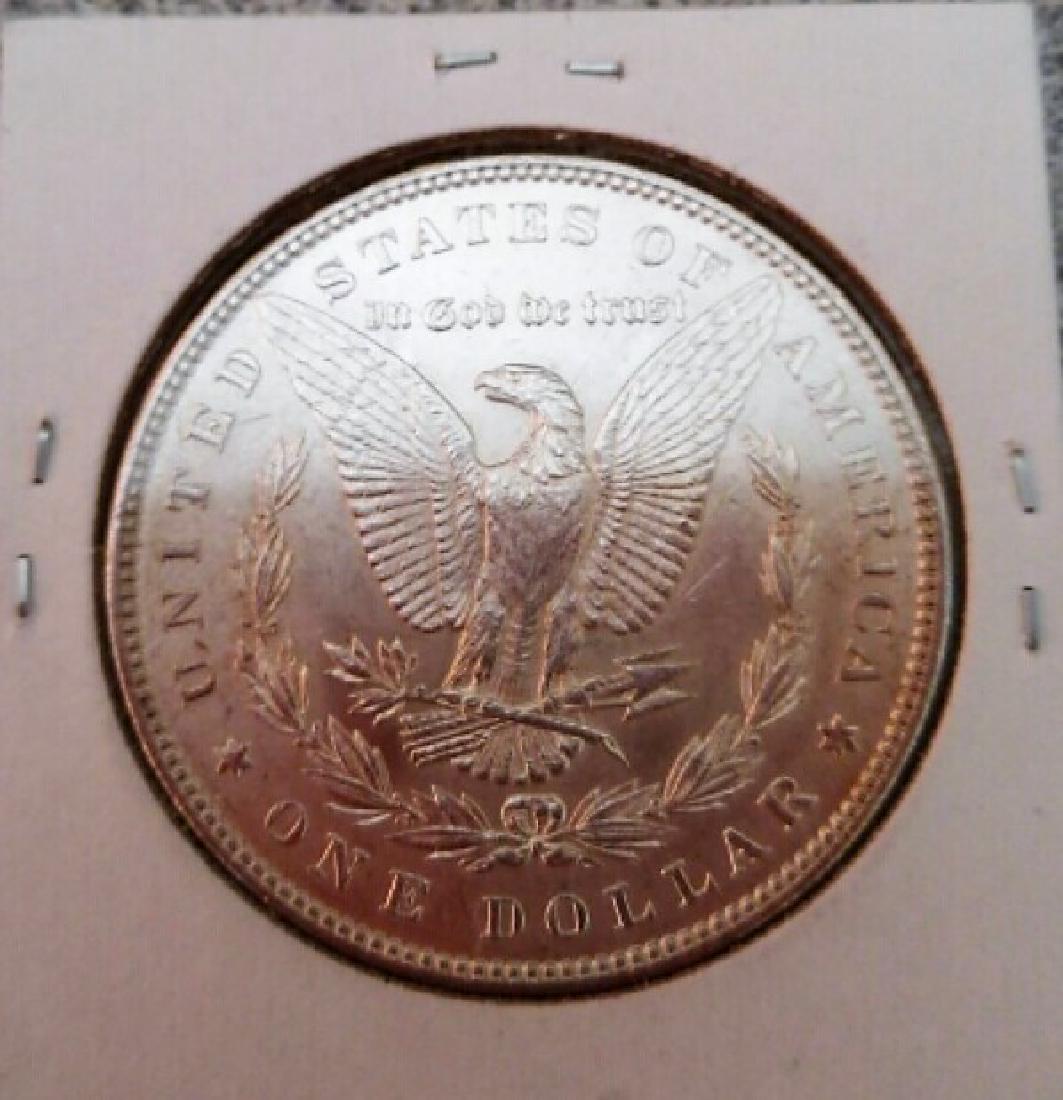 1883 Morgan Dollar: 1883 Morgan Dollar 1883 U.S. Silver 2x2 A real blazer Please note that this lot has a confidential reserve. When you leave a bid in advance of the auction, submit your maximum. The bidder who has subm