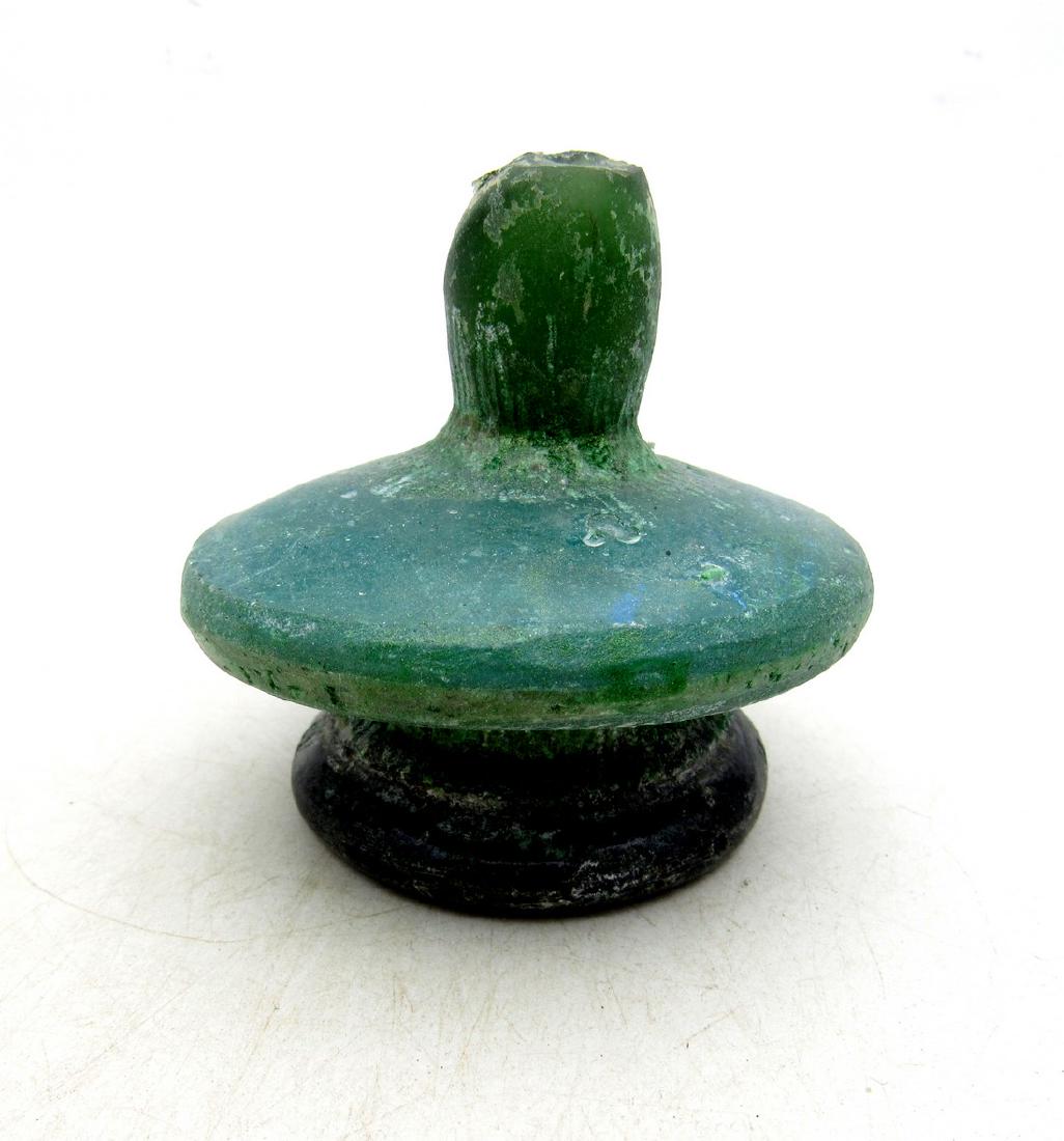 Ancient Roman Glass Flask -re: Item: Ancient Roman Glass Flask -re Date: ca. 100 - 300 AD Whilst the ancient Egyptians and Phoenicians developed coloured glass, mainly for inlays, beads, etc., it was the Romans who perfected the de