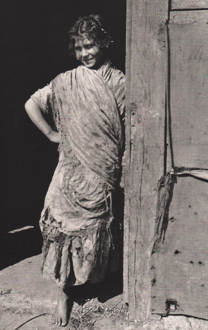 KERTESZ - Young Gypsy Woman, 1918: Artist: KERTESZ Print Title: Young Gypsy Woman, 1918 Medium: Duotone Photoengraving Printed 1982 in Switzerland Image size (inches) approx. 9.5 x 6” Andre Kertesz (1894-1985) born Kertesz Andor, w