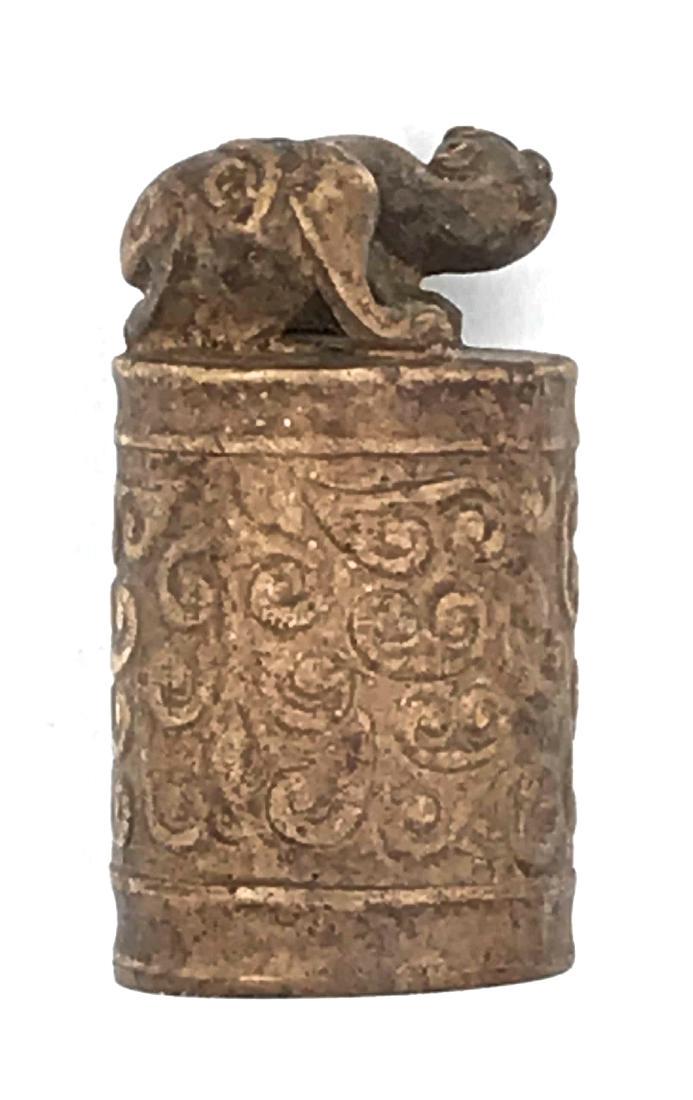Chinese wax seal: Title: Chinese wax seal Origin: China Date: 19-20 century Materials: Stone or alabaster Dimensions: 60 x 33 mm Wax seal made of stone or alabaster carved with arabesque and a beast staying on top. No 