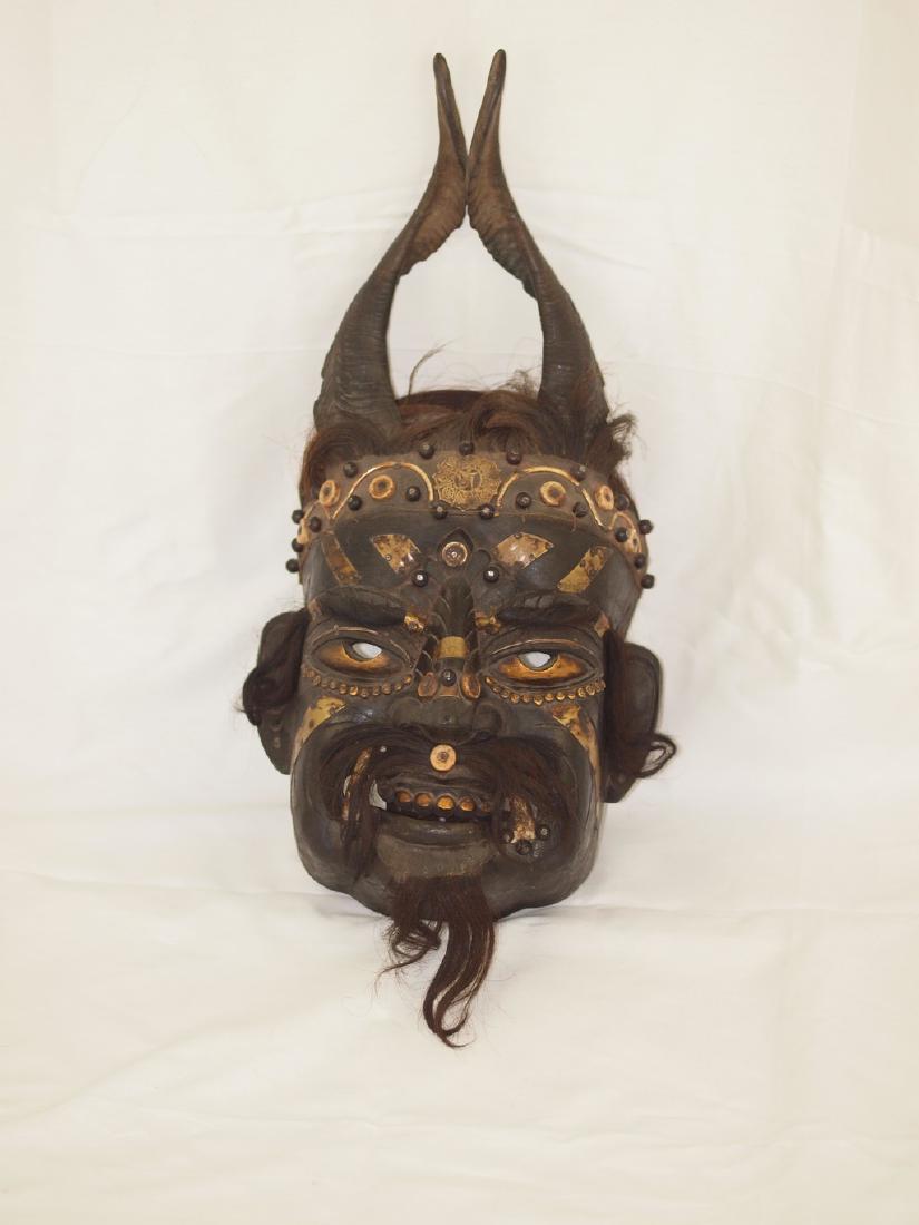 Enchanting antique shaman mask of Tharu: Very antique scarce shaman mask of the Tharu people living the region Terai in Nepal and some areas of Tibet. Shaman masks like this were and are used by shaman of the village during religious animist