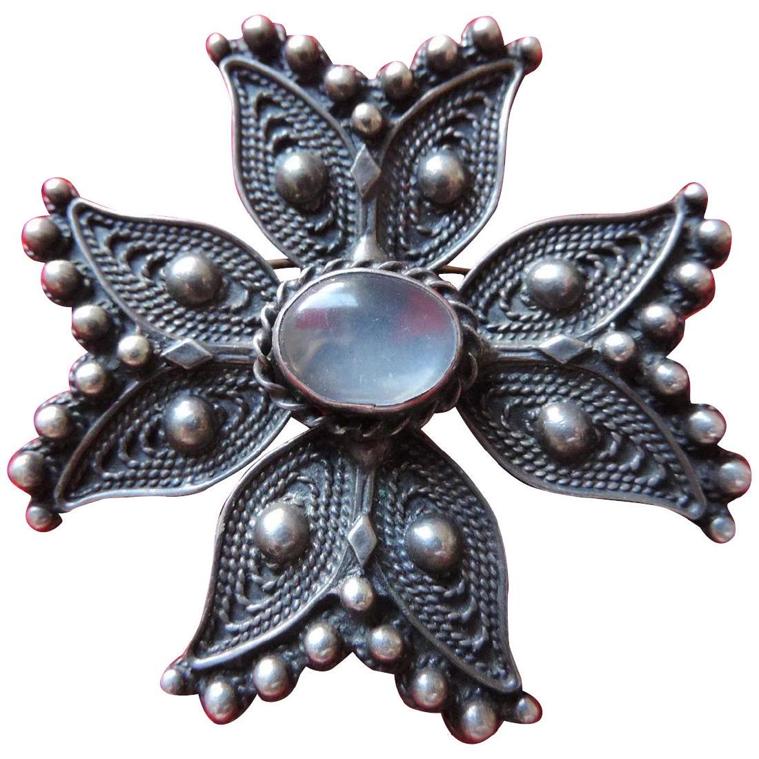 Anodized Sterling Silver and Moonstone Maltese Cross: This is a vintage, sterling silver pin made to resemble a Maltese Cross. It looks like Mexican silver, but it may not be. It is 2" X 2", and weighs 18.4 grams. It is composed of 4 identical swallowtai