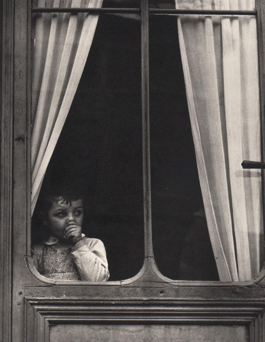 PAUL STRAND - Enfant a la Fenetre: Artist: PAUL STRAND Print Title: Enfant a la Fenetre Medium: Sheet-Fed Gravure Printing Date: 1952 Printed in Switzerland Image Size: 6 X 7.5 inches Paul Strand (1890–1976) was an American photograp