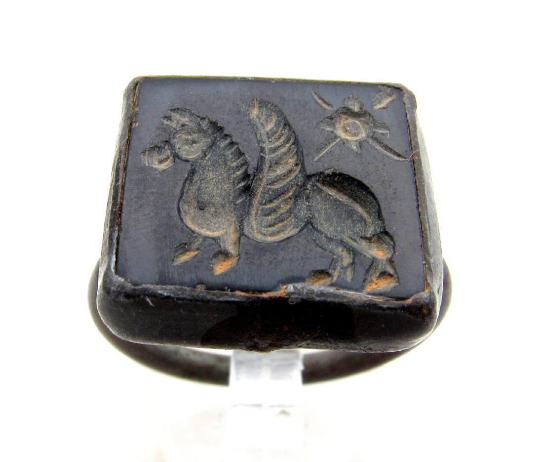 Ancient Stone Intaglio Pegasus Set in Modern Ring: Item: Ancient Stone Intaglio Pegasus Set in Modern Ring Date: 15thC - 18th C AD Material: stone, bronze Dimensions: 19mm; 6.6grams Provenance: Obtained from an old British collection, purchased from a
