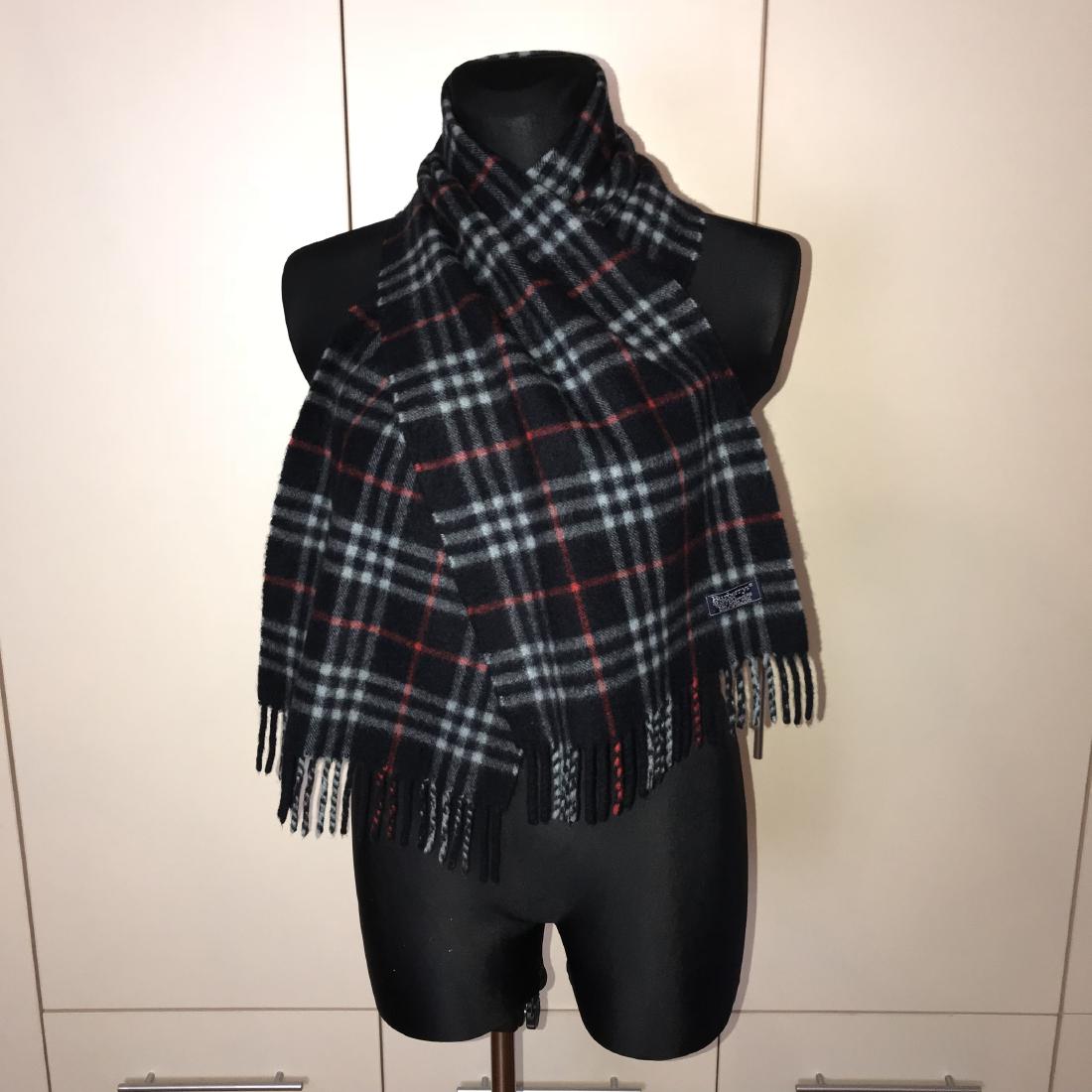 Burberry 100% Cashmere Dark Blue Nova Check Scarf CW324: Item: Burberry 100% Cashmere Dark Blue Nova Check Scarf CW324 Date/Period: Vintage Materials: 100% Cashmere Size: "Measurements (inches): Width: 11.5 Length: 57 " Please note that this lot has a confi