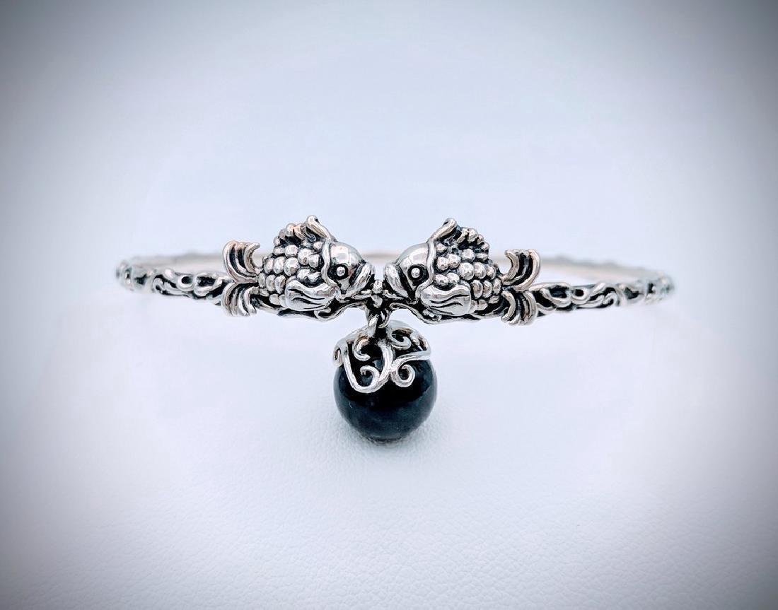 Sterling Silver Bangle with Koi Fish Design and Dangly: Item: Sterling Silver Bangle with Koi Fish Design and Dangly Nuumite Brand: Jean Lin Collection Metal Purity: 925 Sterling Silver Gemstones: Nuumite Carat Weights: 1 Nuumite at 9.6mm. Size/Dimensions: