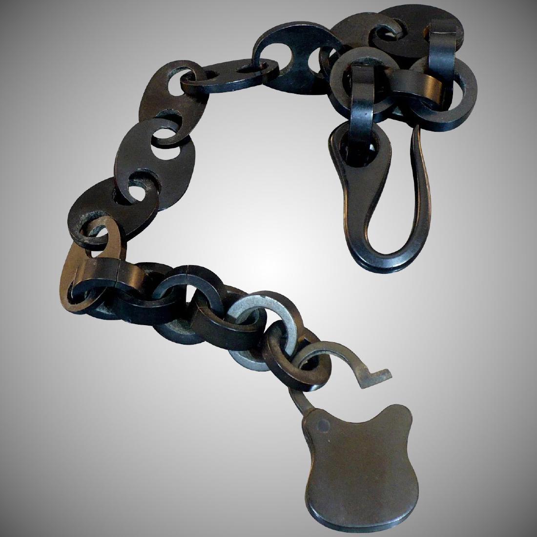 Victorian Gutta Percha watch chain with working lock: Item: Victorian Gutta Percha watch chain with working lock Size/Dimensions: 8 inch Please note that this lot has a confidential reserve. When you leave a bid in advance of the auction, submit your max