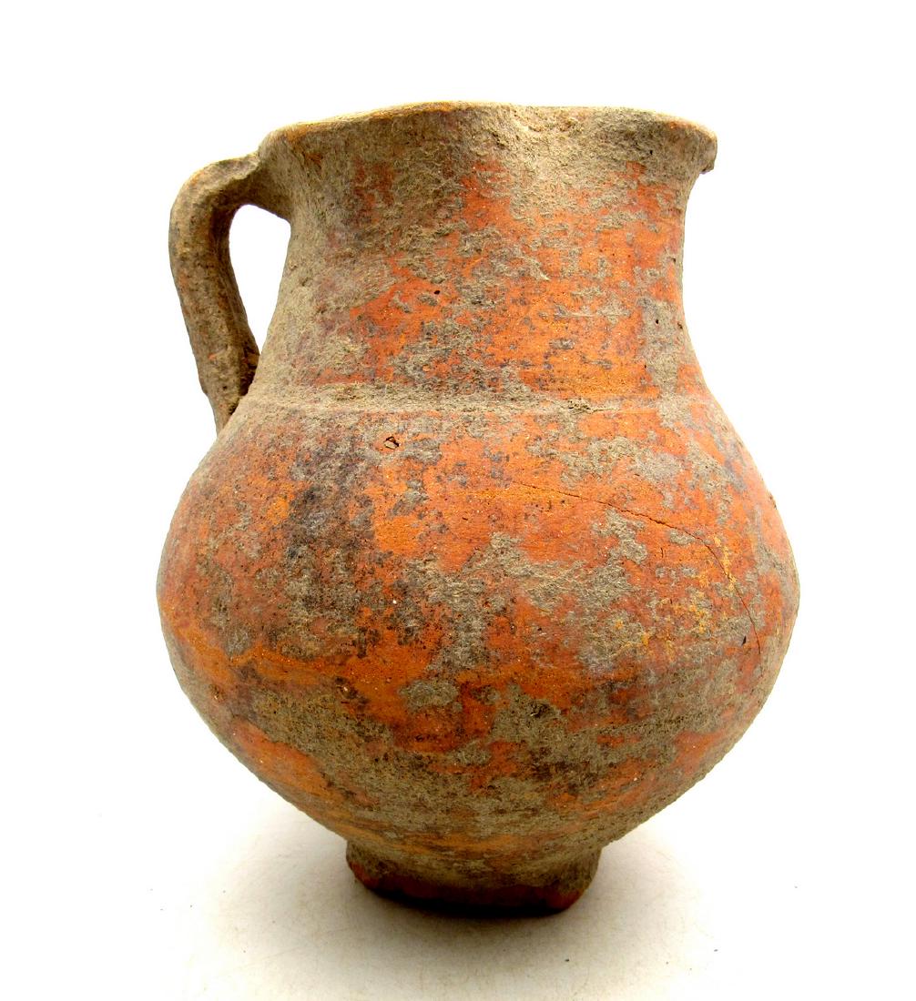 Ancient Roman Terracotta Wine Pouring Jug: Ancient Roman Terracotta Wine Pouring Jug Date: ca. 100 - 300 AD Superb Ancient Roman Legionary wine pouring jug with attached handle. Nice, redware ceramics, typical for the central Roman provinces s