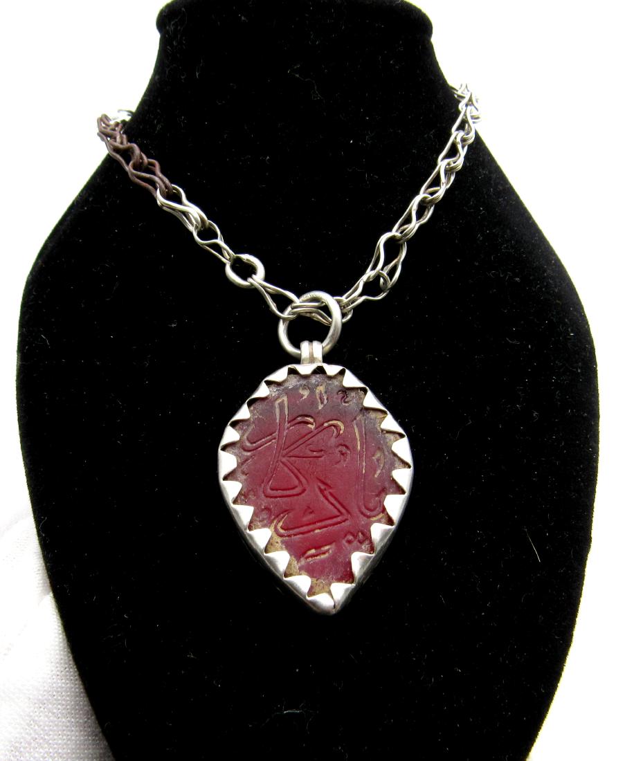 Crusaders Era Silver Pendant with Islamic Carnelian: Crusaders Era Silver Pendant with Islamic Carnelian Intaglio Date: ca. 1300 AD Superb Holy Land silver Pendant with carved Intaglio in the middle; engraved with islamic script. The item comes with a L