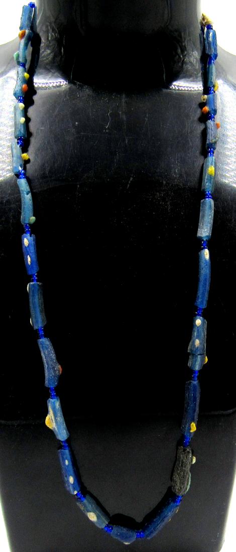 Viking Period Glass Beaded Necklace: Viking Period Glass Beaded Necklace Date: ca. 900 AD Superb, Medieval, Viking Period Glass Beaded Necklace; nicely coloured beads. The item is suitable for contemporary wear. This item has been profes