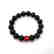 Bracelet Baltic amber Coral black&red ø10mm 13.4 grams - 2