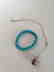 a set of turquoise bracelace and silver agent necklace