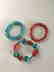 a set of turquoise/sarcandra glabra bracelace