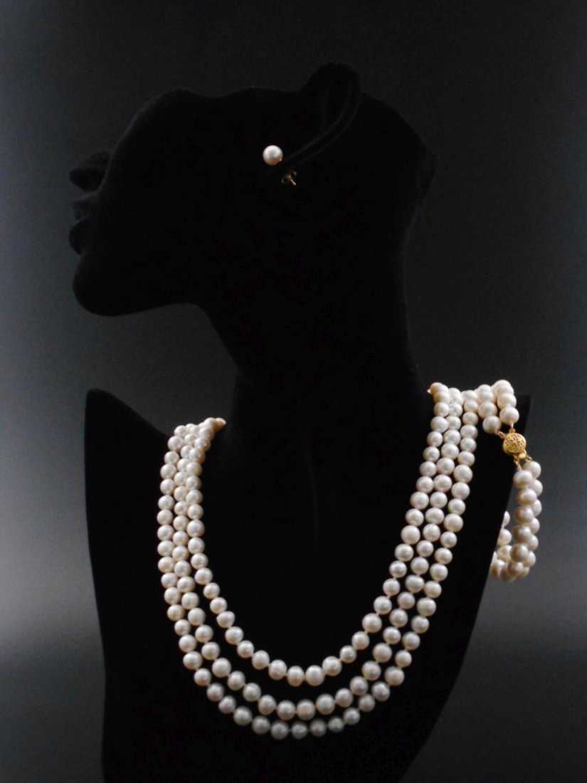 Set of triple strand pearl necklace, earings and: Title: Set of triple strand pearl necklace, earings and bracelet made of white cultured fresh water pearls Date/Period: 2018 Materials: 14ct gold, cultured fresh water pearls Size: 17 inch Set of trip
